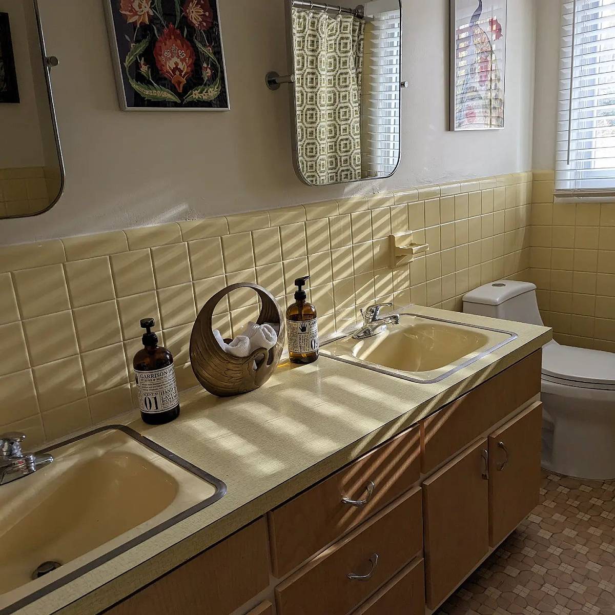 Yellow bathroom with brown cabinets