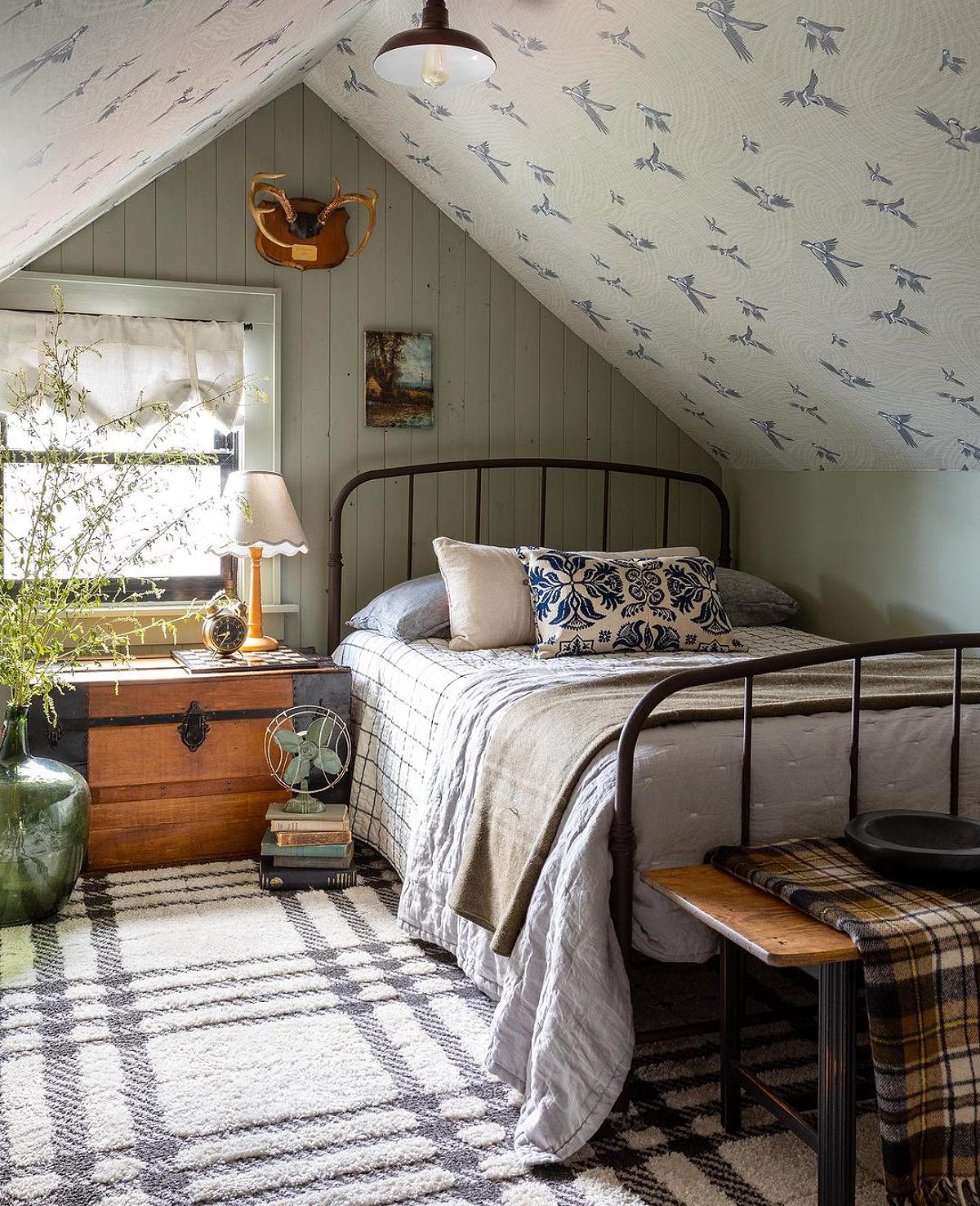 attic bedroom with birds wallpaper