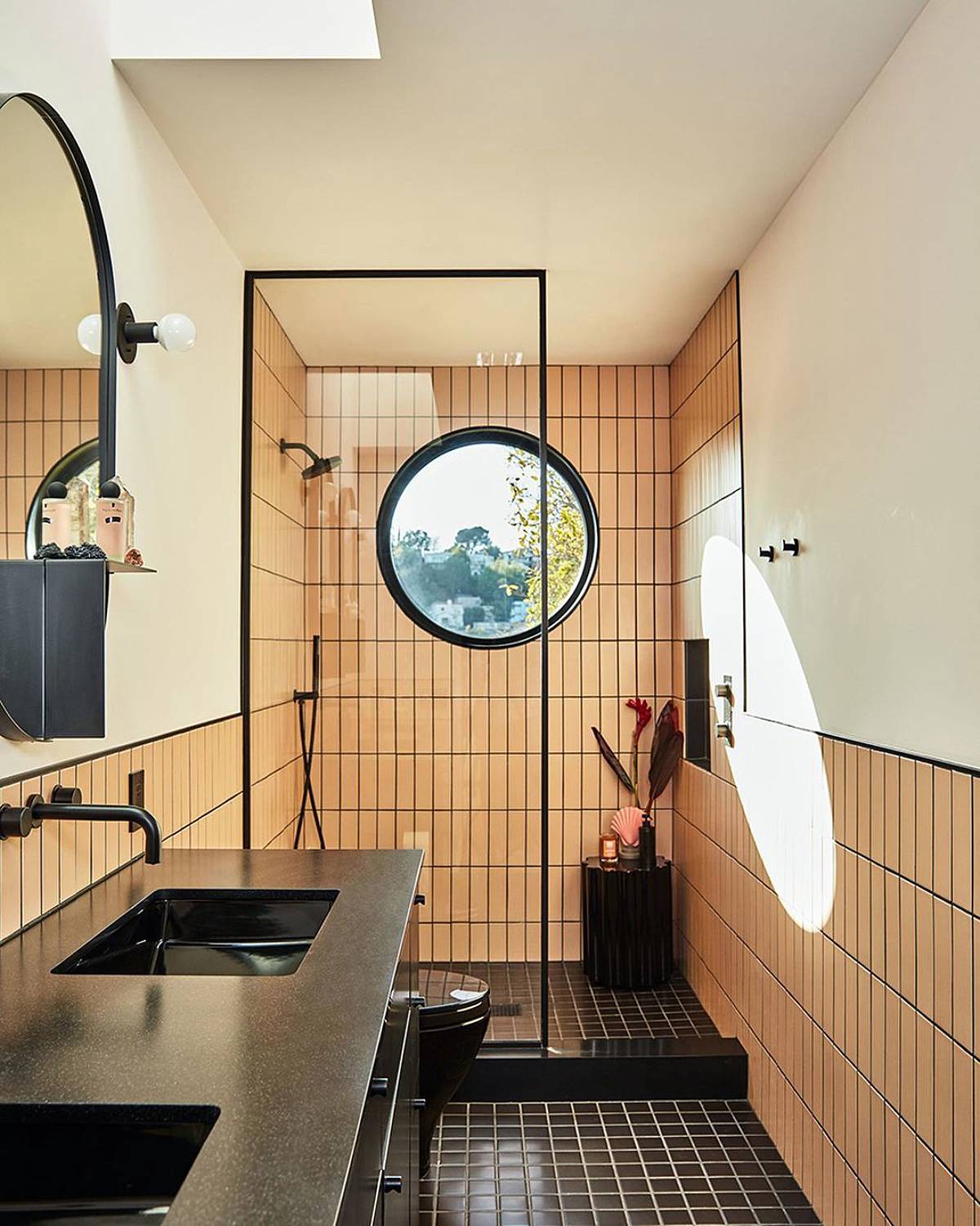 bathroom with black floor tiles