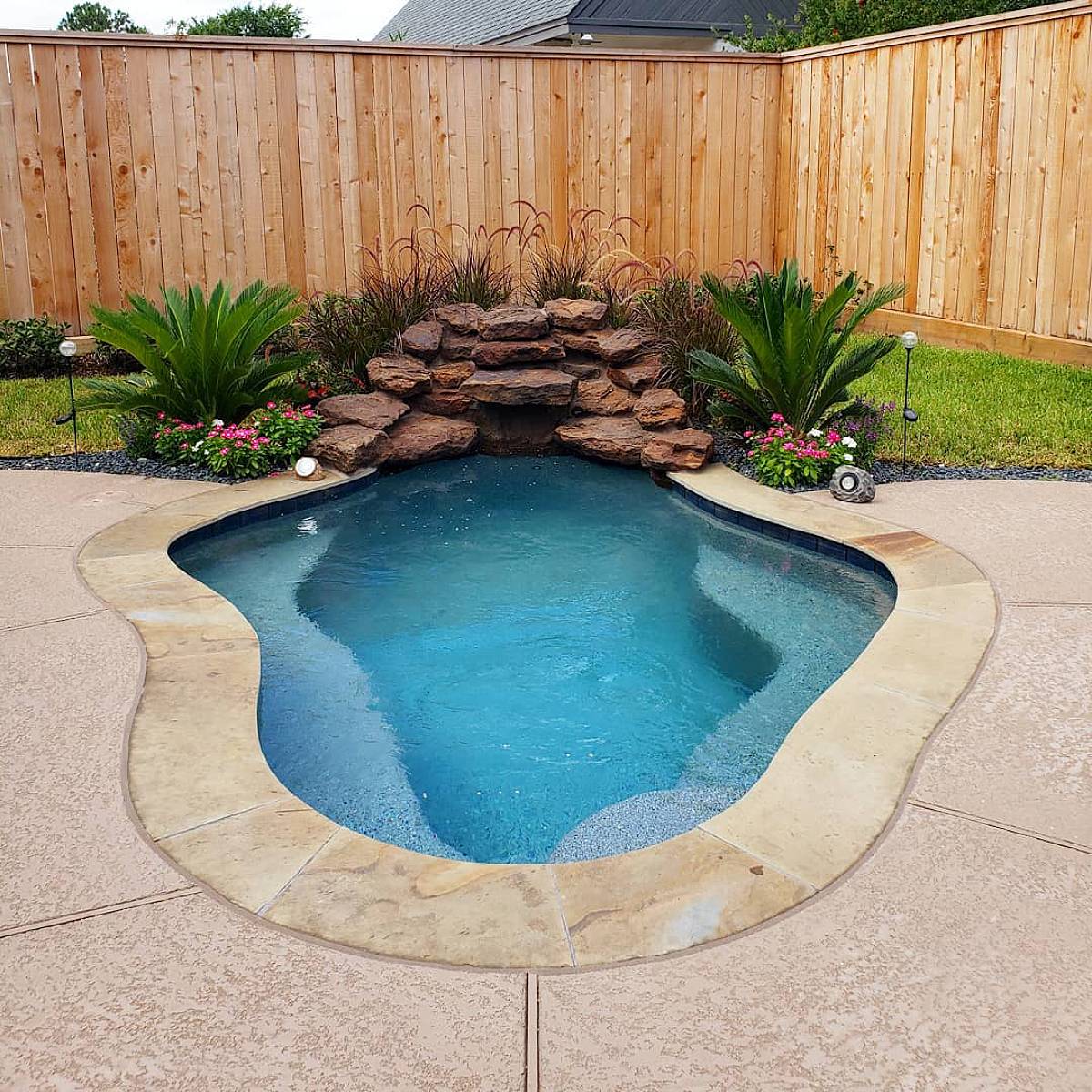 curvy pool with grotto