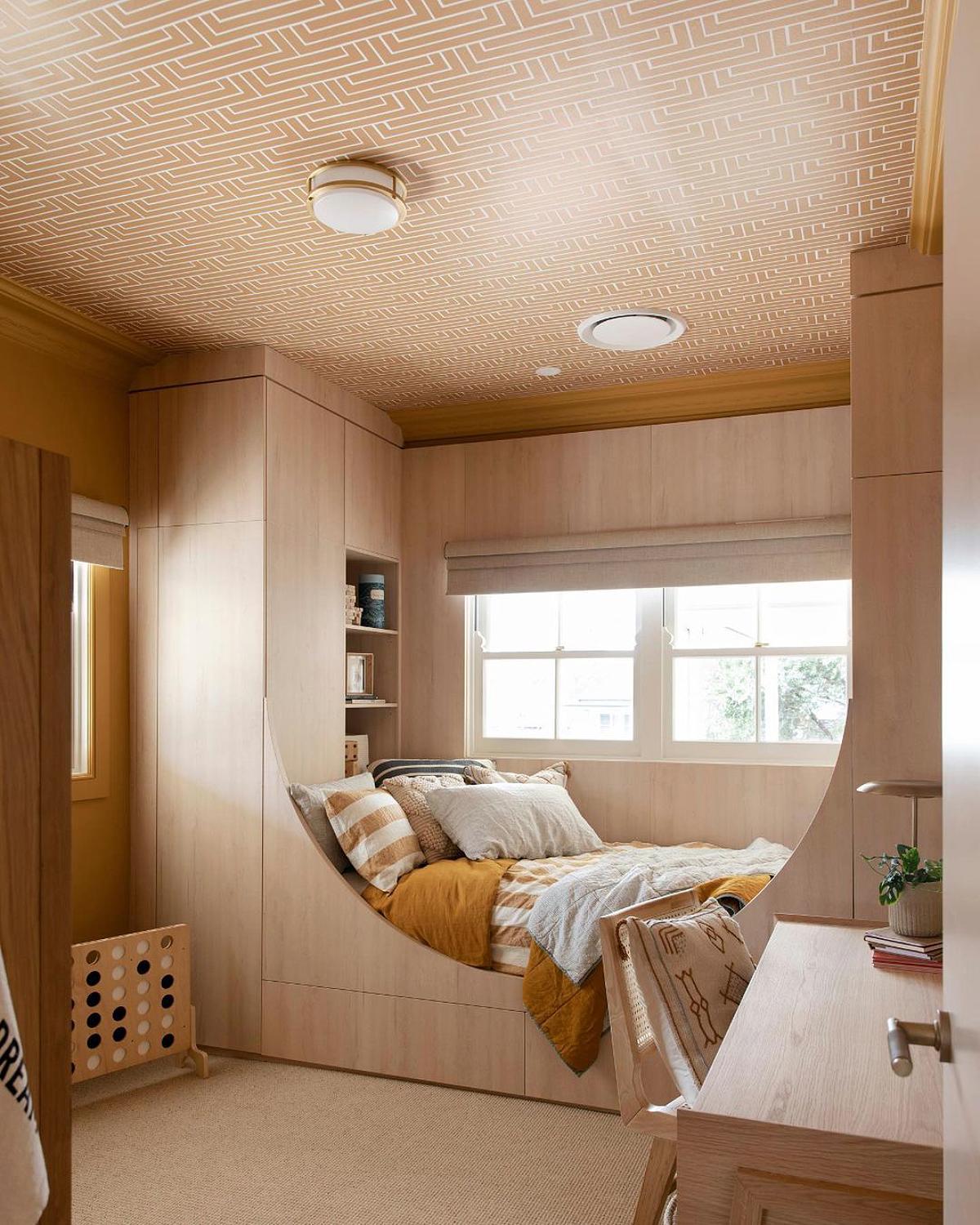 matching ceiling wallpaper and bed nook