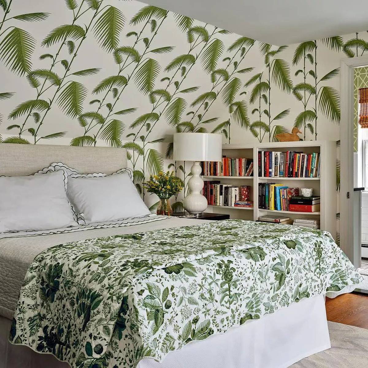 sloped ceiling bedroom with palm tree leaves wallpaper