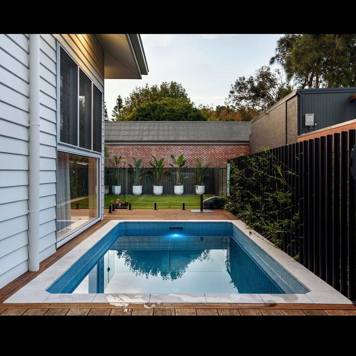 swimming pool with a nice garden view