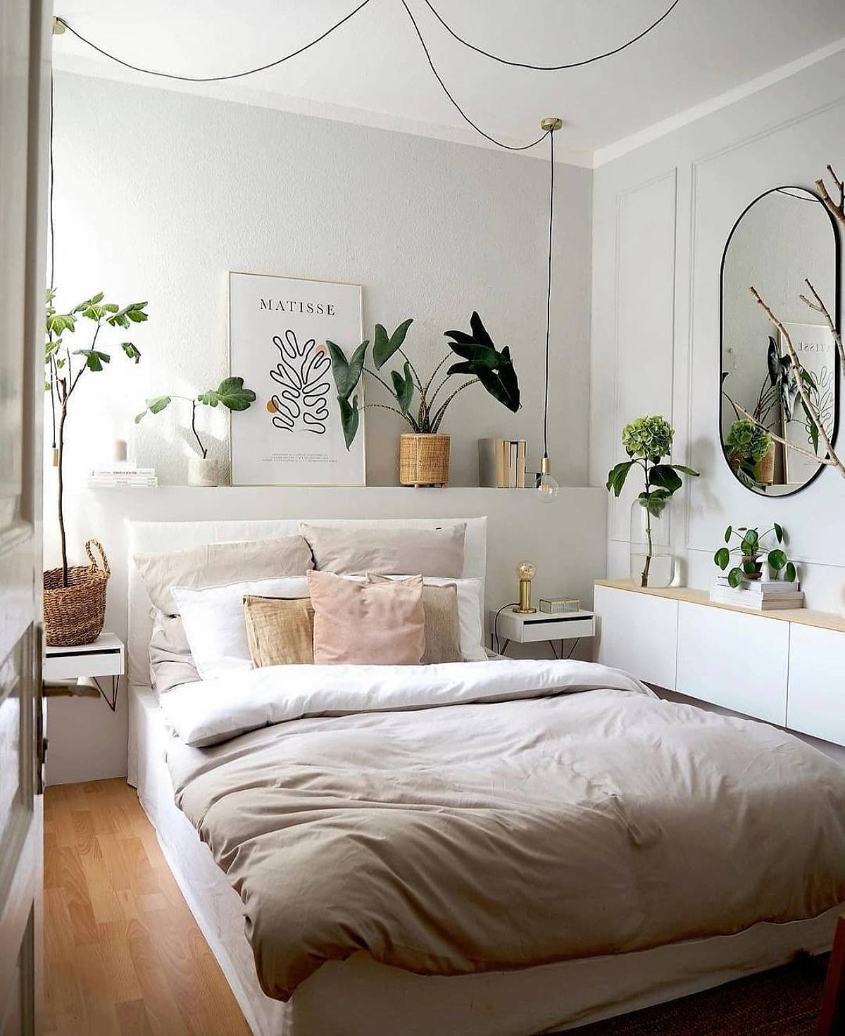white bedroom with plants