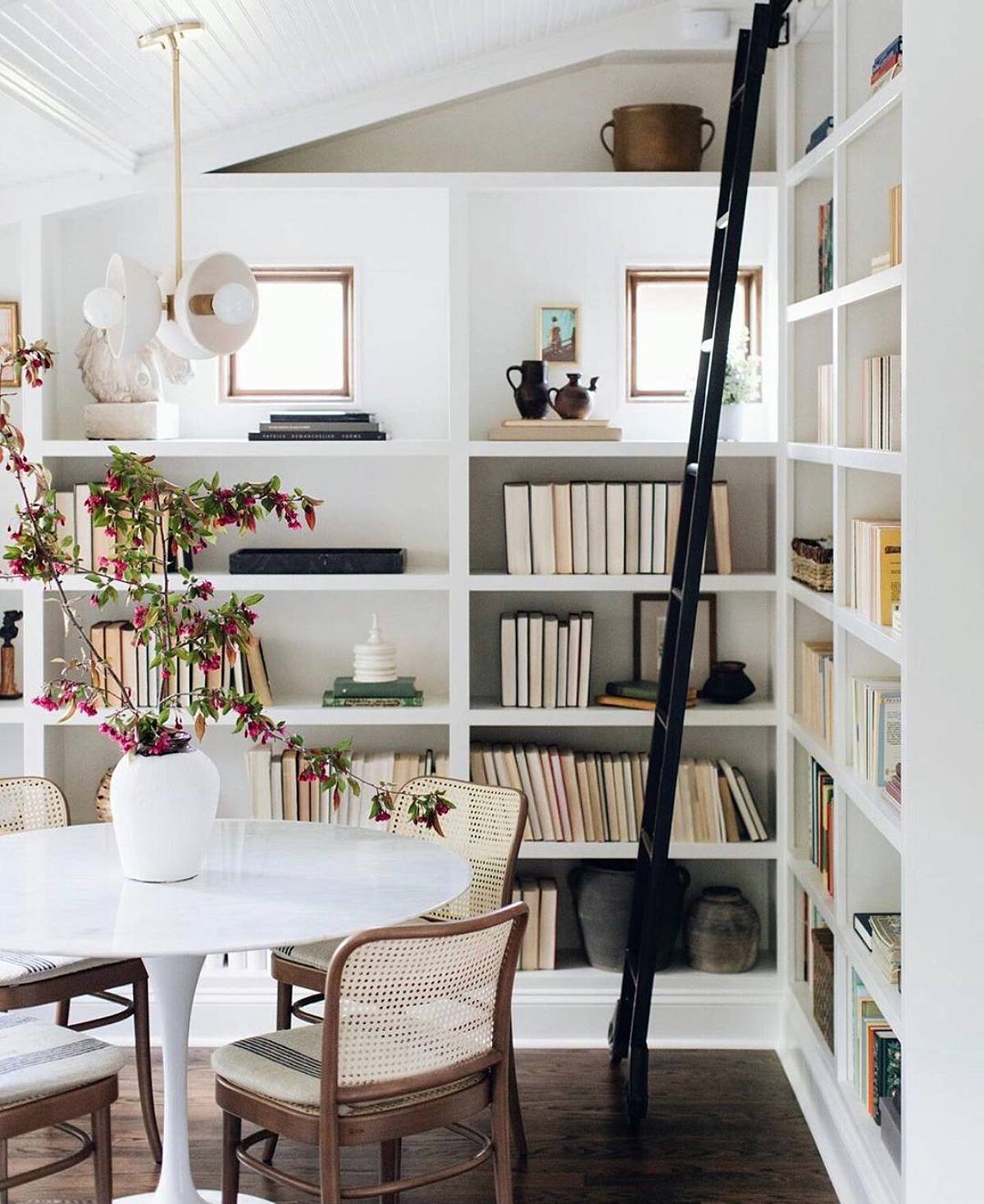 floor to ceiling bookshelves with ladder