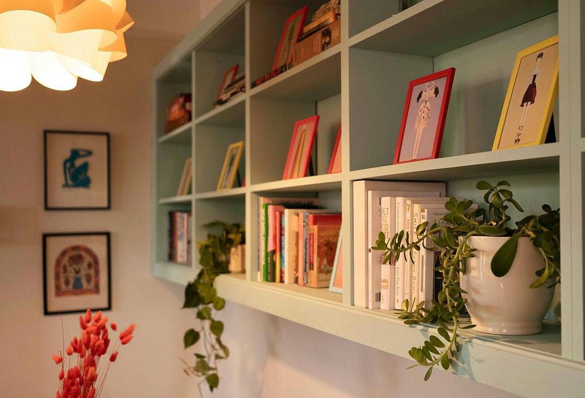 green under-ceiling bookshelves