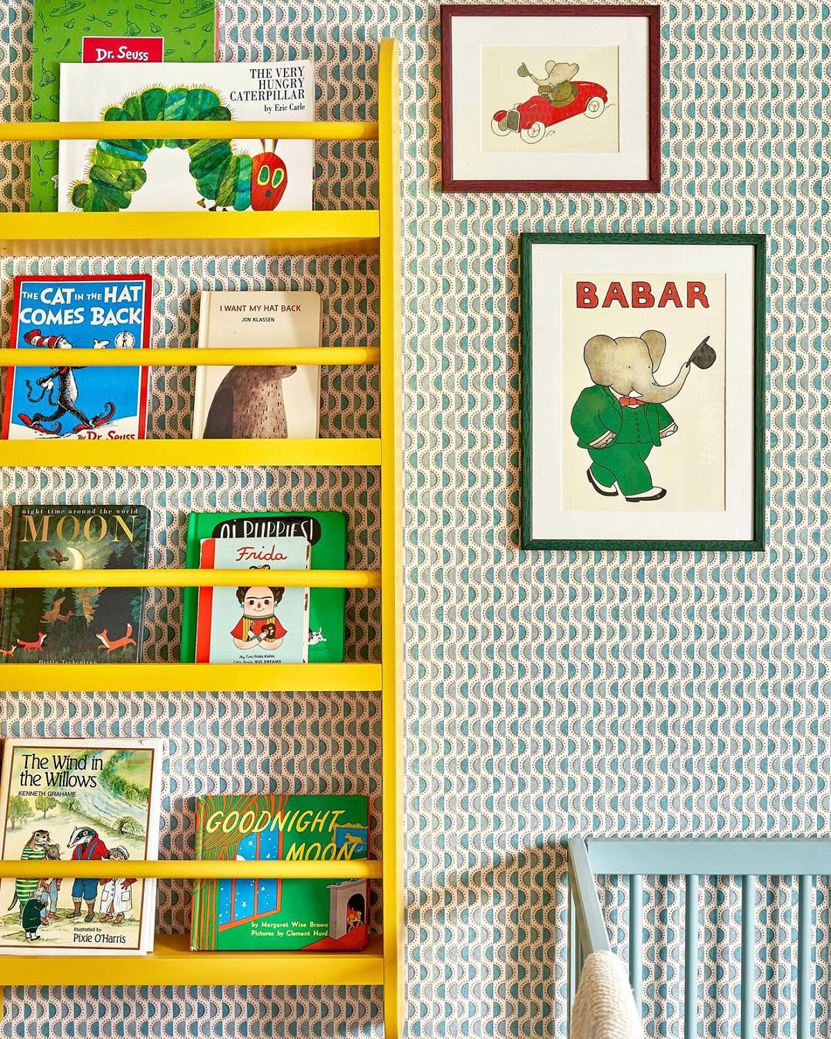 green wallpaper and yellow bookshelves