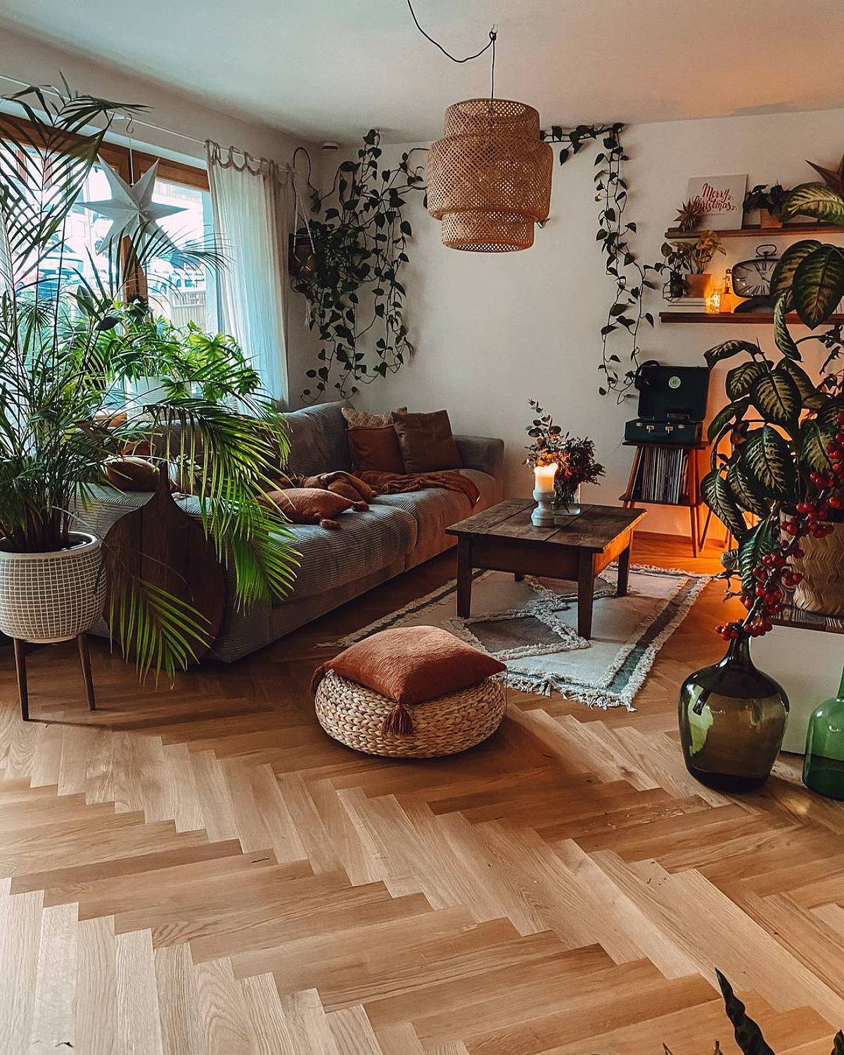 living room with herringbone wooden tile and palm tree
