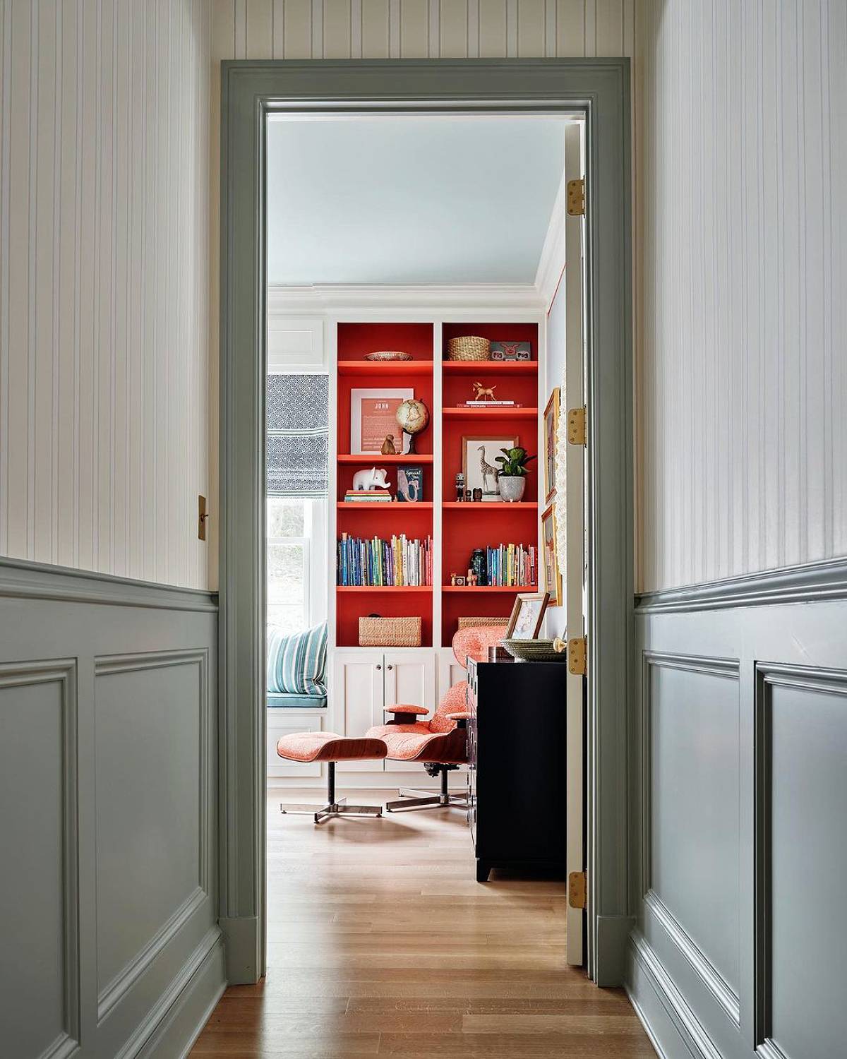 red bookshelves on hallway view