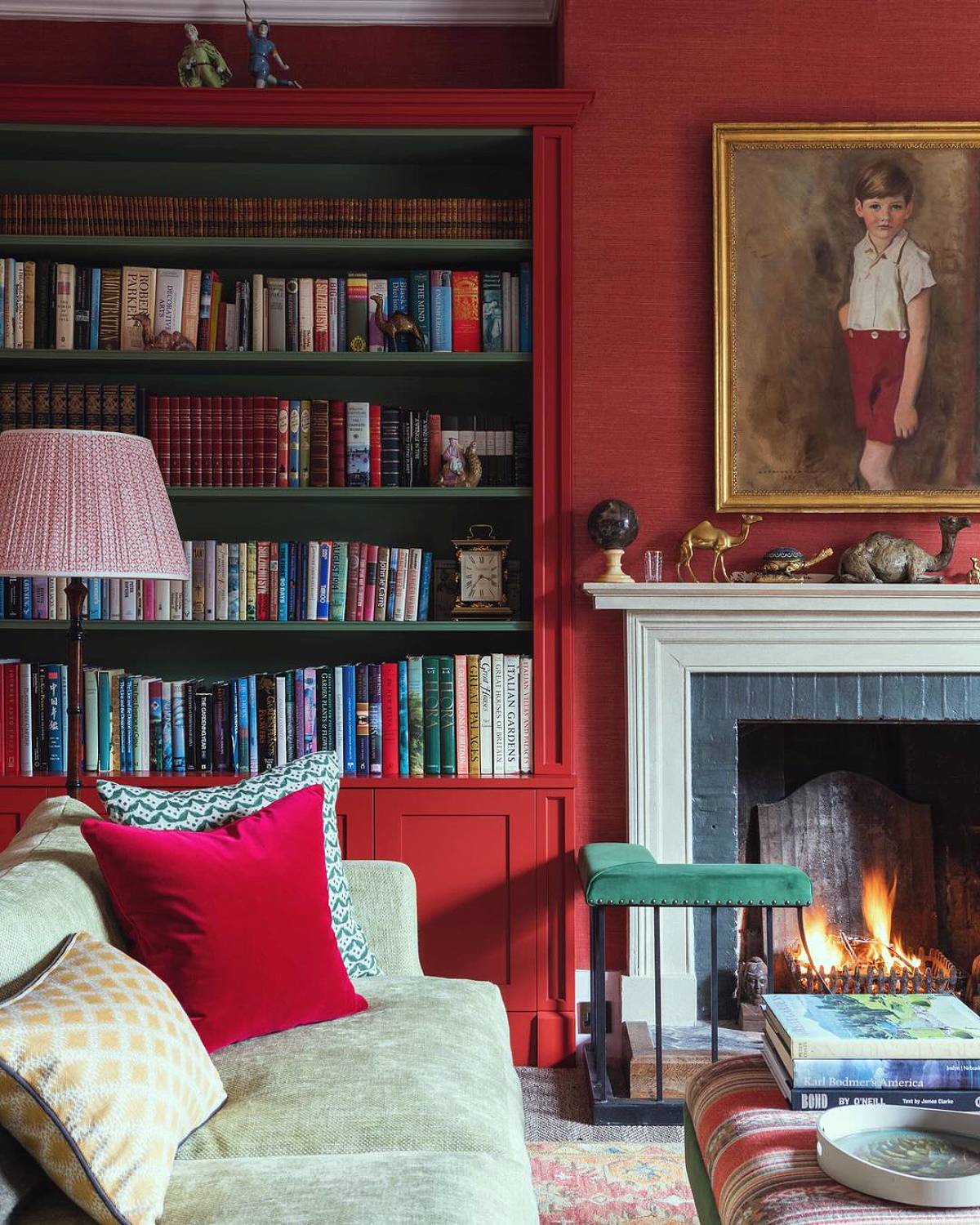 red wall and cabinets and green bookshelves