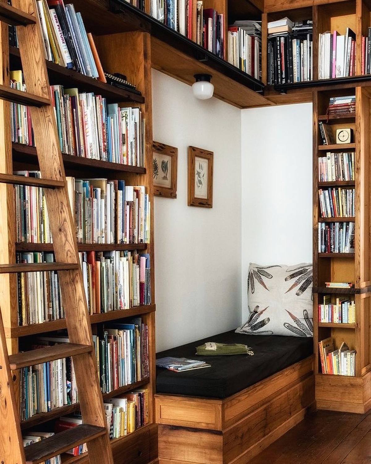 rustic floor to ceiling bookshelves and corner reading nook