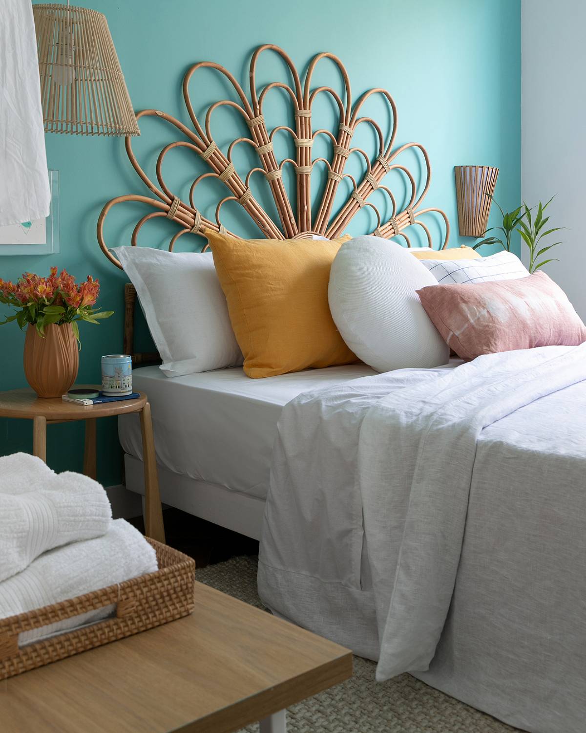 bed with flower headboard and plants
