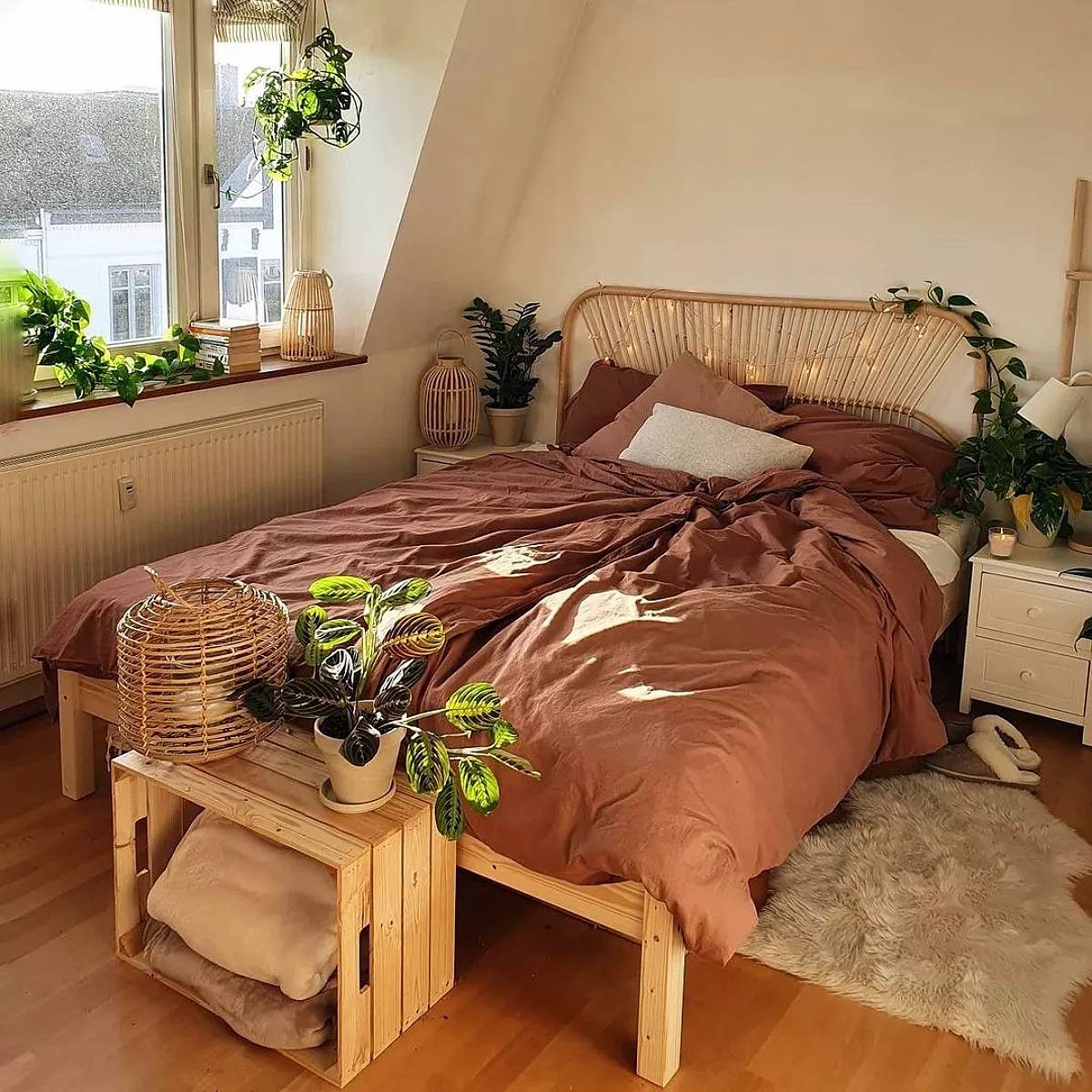 bedroom with plant on a pallet box table